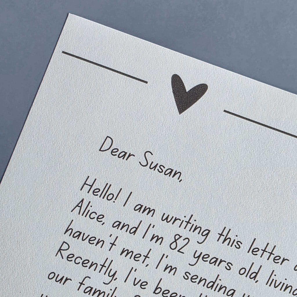 A detailed macro shot of premium 24-pound ivory bond paper, showing its smooth matte texture and warm off-white color.