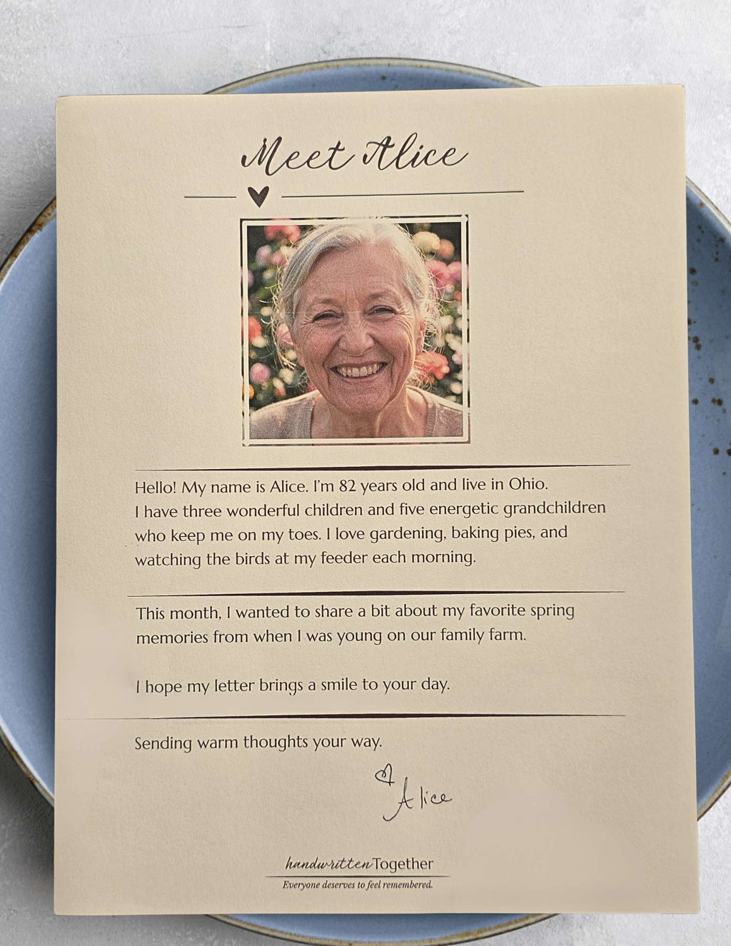 A printed biography card featuring a portrait and background story of this month's featured letter writer.
