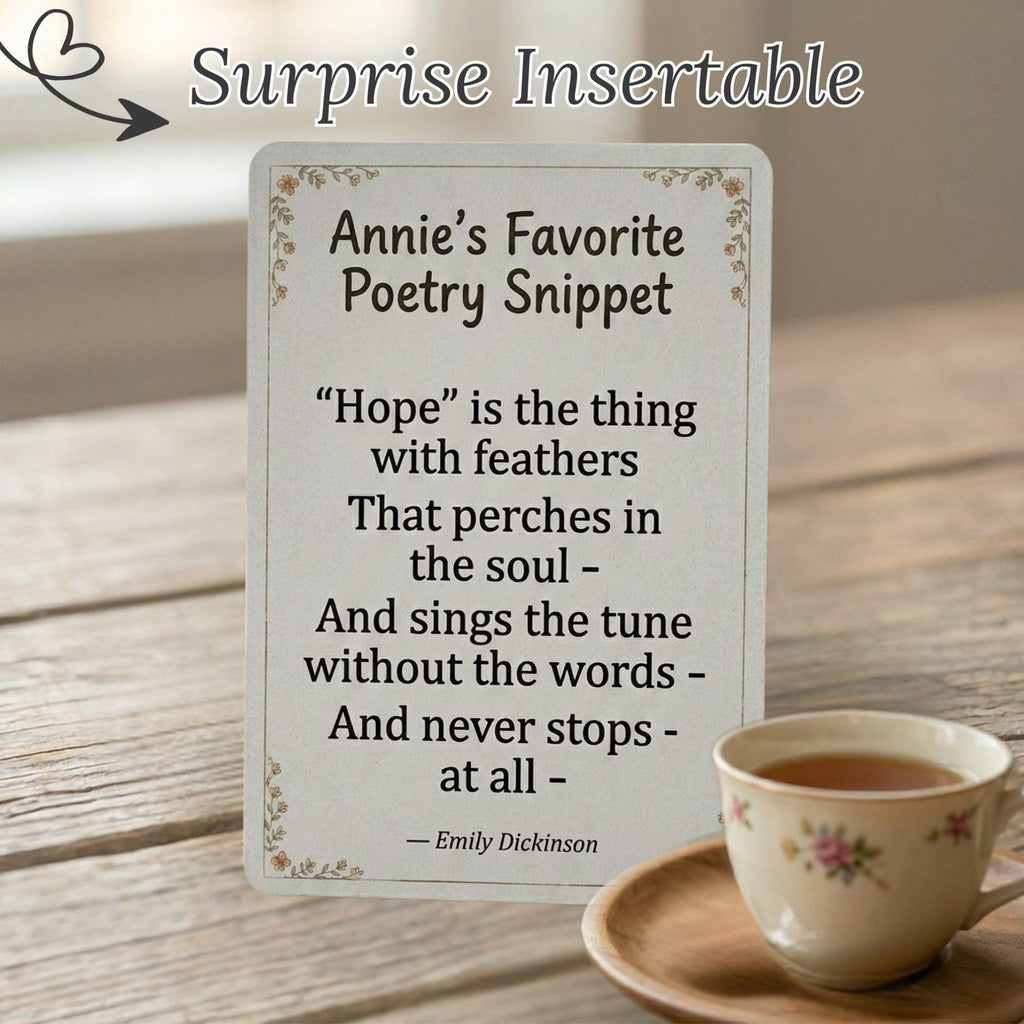 A delicate, decorative paper snippet featuring a piece of Annie’s favorite poetry, included as a surprise literary keepsake tucked inside the monthly letter.