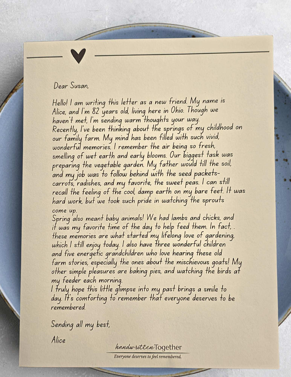 A close-up of a handwritten letter on cream-colored parchment paper with an ink-stamp seal for the monthly subscription.