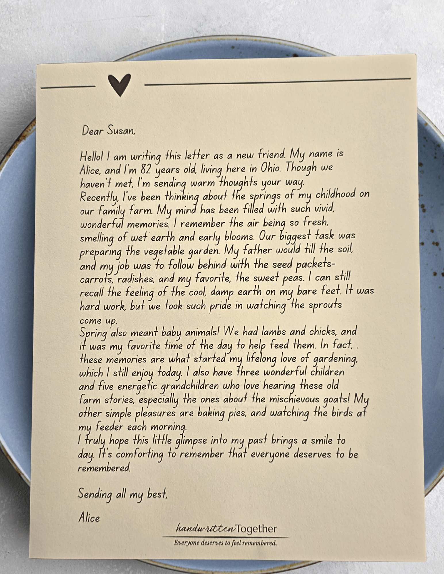 A close-up of a handwritten letter on cream-colored parchment paper with an ink-stamp seal for the monthly subscription.